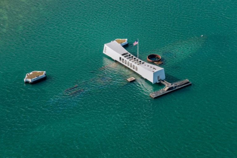 Aerial view of the USS Arizona Memorial at Pearl Harbor from a helicopter tour