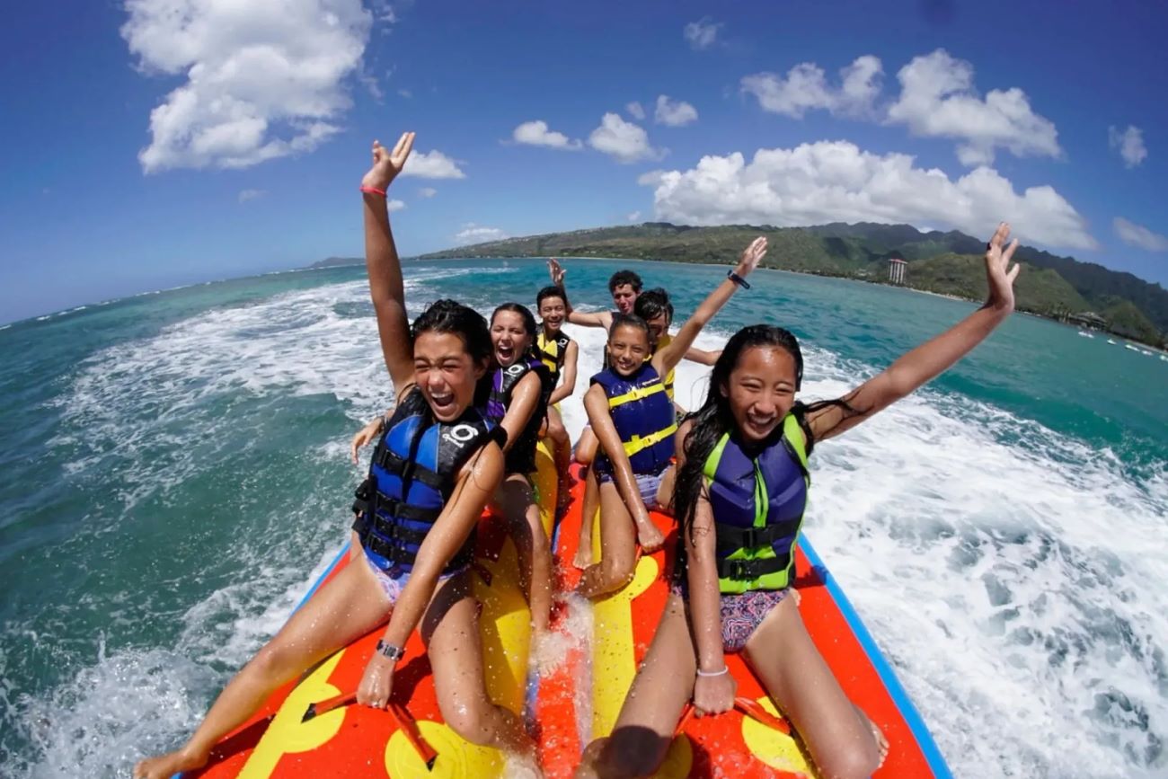 Banana boat ride towed behind a jet ski on Maunalua Bay
