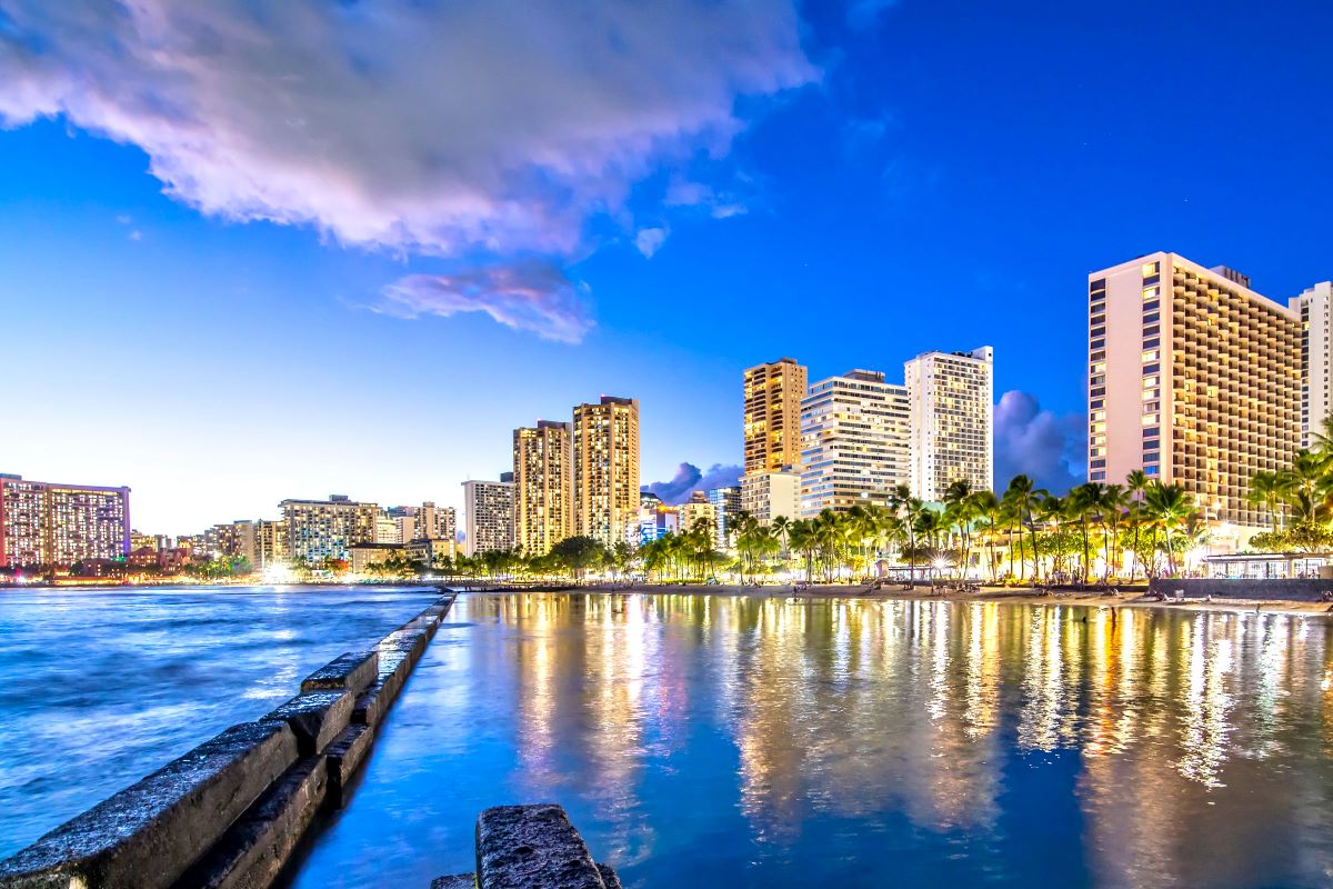 Waikiki hotels and beach at dusk on Oahu, seen from the water