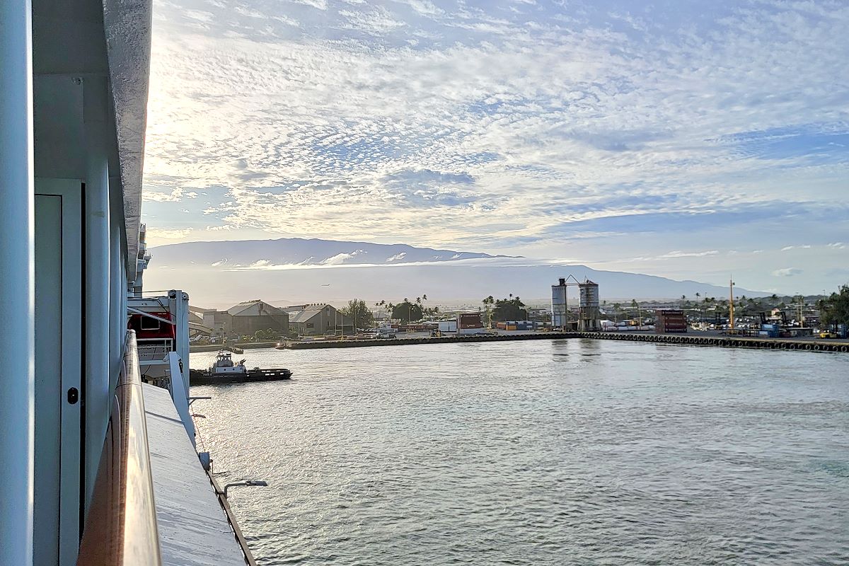 Arriving into Kahului Harbour on Maui from the ship rail, with Haleakala in the distance