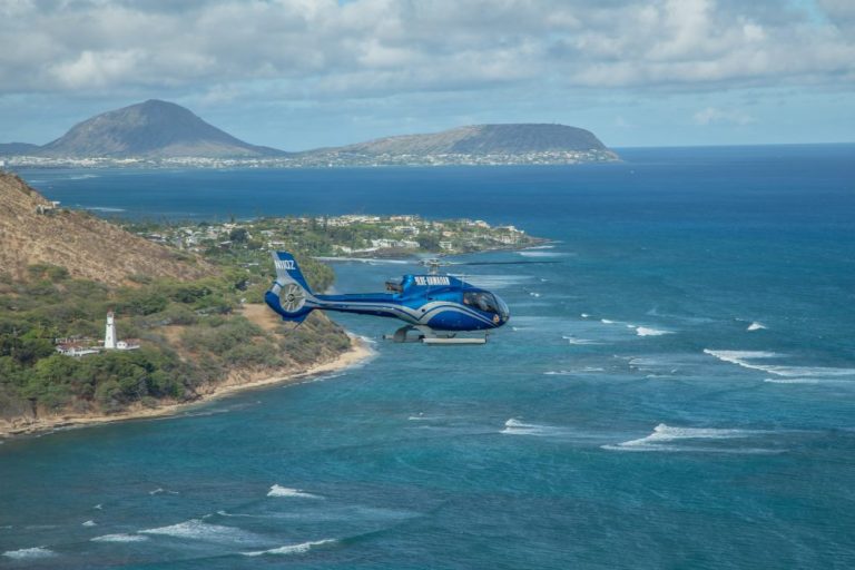 Helicopter flying along Oahu's southeast coastline above Hanauma Bay