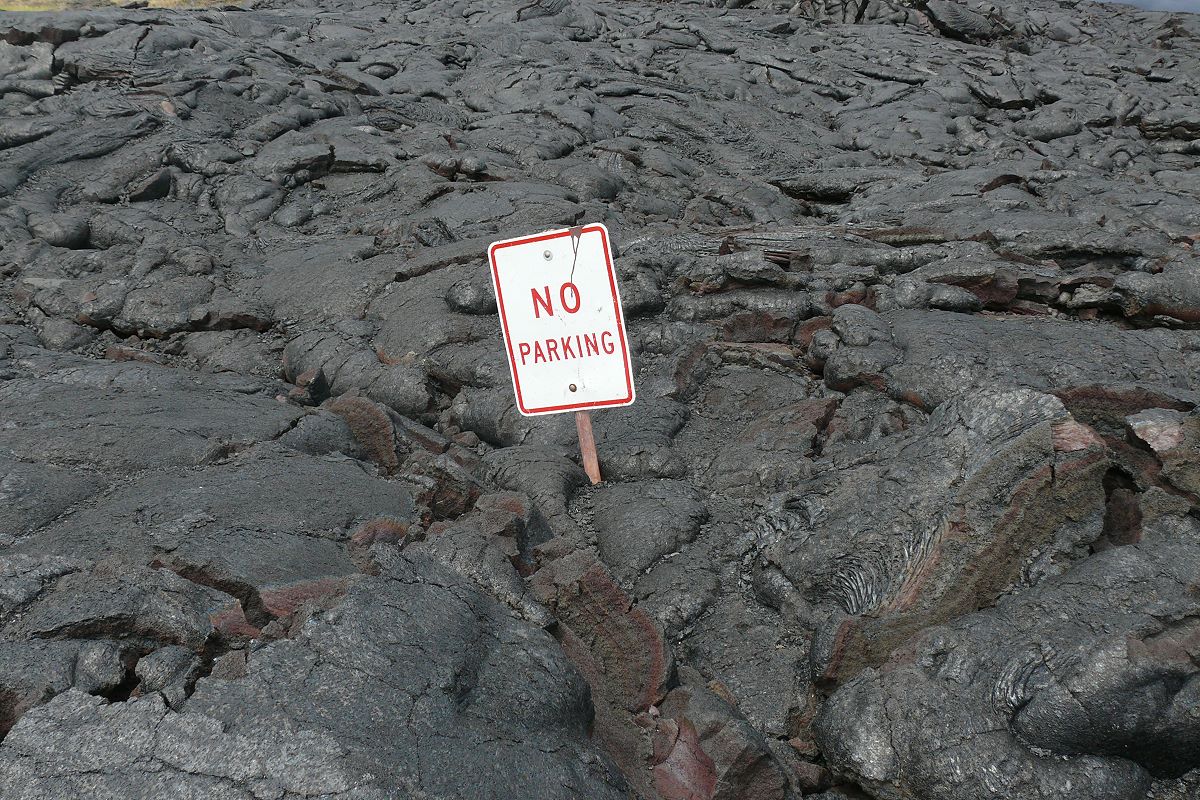 A road sign left standing in a hardened lava field on the Big Island